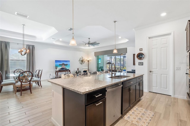 25325 Longmeadow Dr, Punta Gorda, FL 33955 - kitchen featuring visible vents, a sink, a tray ceiling, ceiling fan with notable chandelier, and stainless steel dishwasher