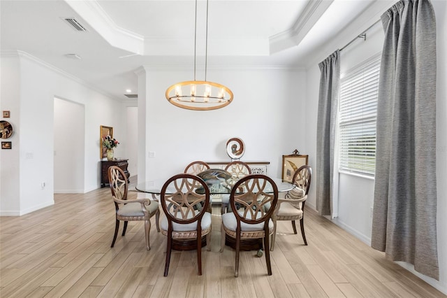 25325 Longmeadow Dr, Punta Gorda, FL 33955 - dining room with a notable chandelier, visible vents, a raised ceiling, and light wood-style floors