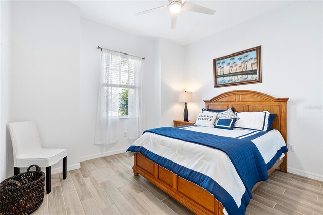25325 Longmeadow Dr, Punta Gorda, FL 33955 - bedroom with light wood finished floors, ceiling fan, and baseboards