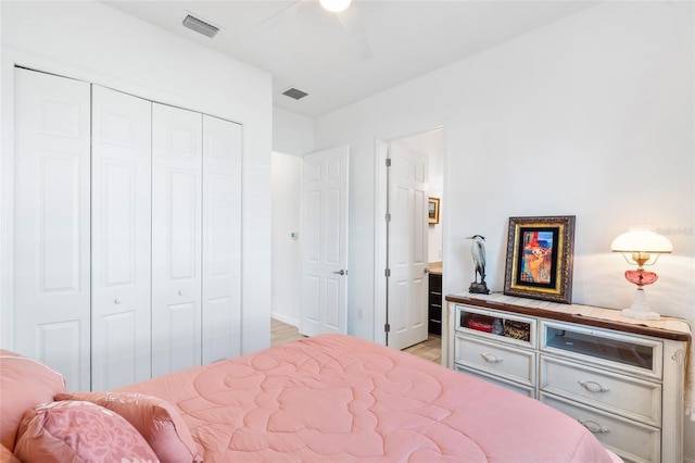 25325 Longmeadow Dr, Punta Gorda, FL 33955 - bedroom with a closet, visible vents, light wood finished floors, and ensuite bathroom