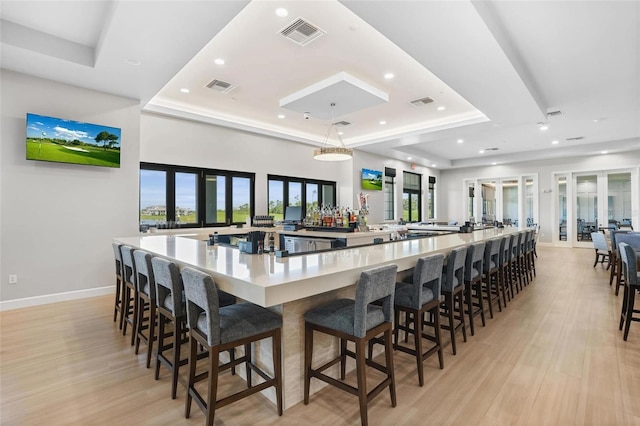 25325 Longmeadow Dr, Punta Gorda, FL 33955 - bar with a tray ceiling, baseboards, and visible vents