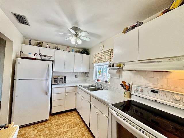 1633 Leisure Dr Unit M-37, Bradenton, FL 34207 - kitchen with visible vents, under cabinet range hood, light countertops, white appliances, and a sink