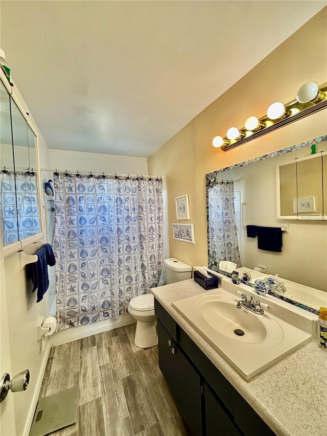 1633 Leisure Dr Unit M-37, Bradenton, FL 34207 - full bath featuring shower / tub combo, toilet, wood finished floors, and vanity