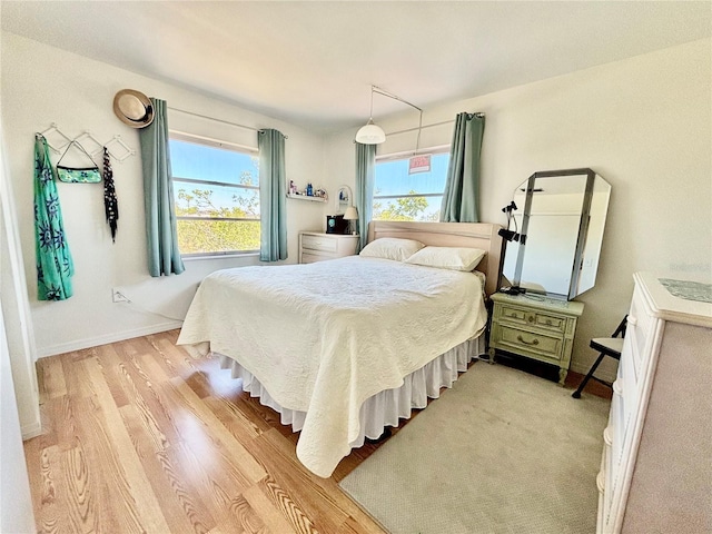 1633 Leisure Dr Unit M-37, Bradenton, FL 34207 - bedroom featuring baseboards and light wood-style floors