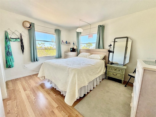 1633 Leisure Dr Unit M-37, Bradenton, FL 34207 - bedroom featuring baseboards and light wood-type flooring
