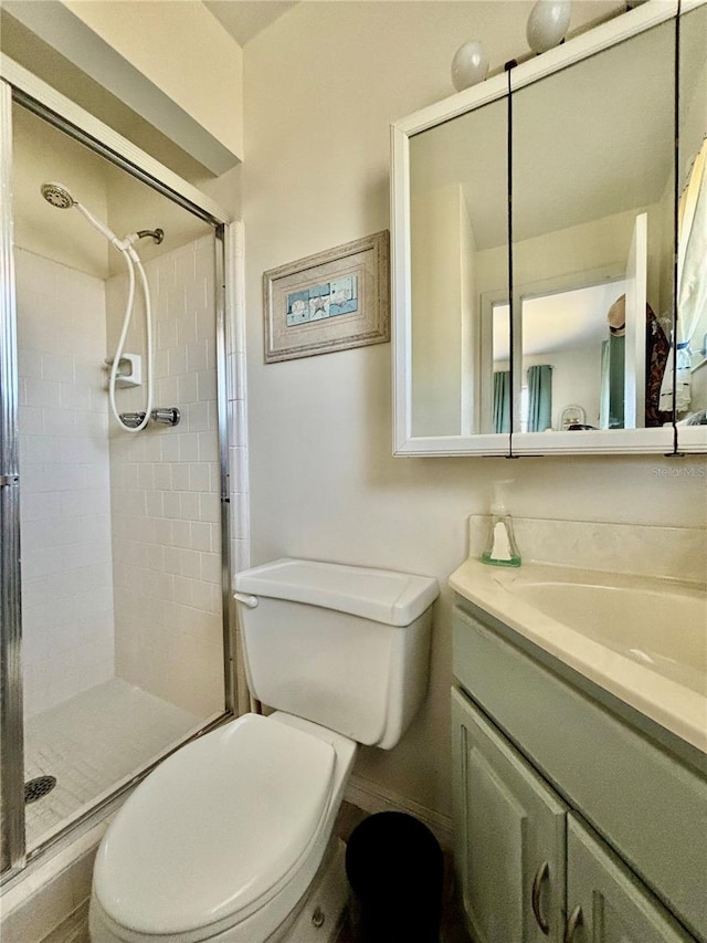 1633 Leisure Dr Unit M-37, Bradenton, FL 34207 - full bathroom featuring a stall shower, toilet, and vanity