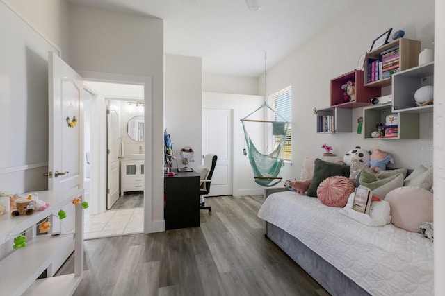 4606 Lake Fox Pl, Parrish, FL 34219 - bedroom featuring wood finished floors and ensuite bath