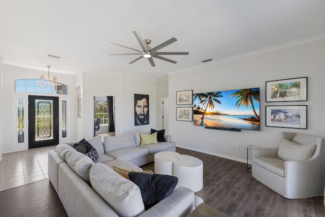 4606 Lake Fox Pl, Parrish, FL 34219 - living area featuring dark wood-type flooring, a chandelier, ceiling fan, crown molding, and baseboards