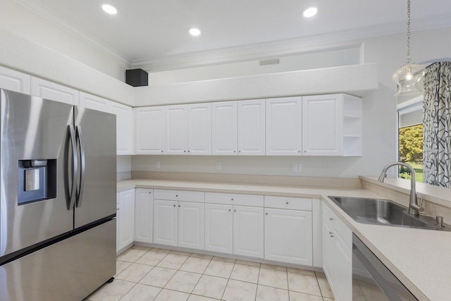 4606 Lake Fox Pl, Parrish, FL 34219 - kitchen featuring stainless steel appliances, a sink, light tile patterned floors, light countertops, and crown molding