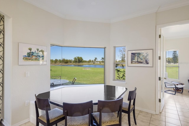 4606 Lake Fox Pl, Parrish, FL 34219 - dining space featuring a water view, light tile patterned floors, ornamental molding, and baseboards