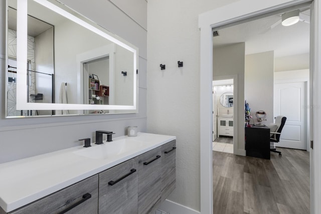 4606 Lake Fox Pl, Parrish, FL 34219 - bathroom with wood finished floors and vanity