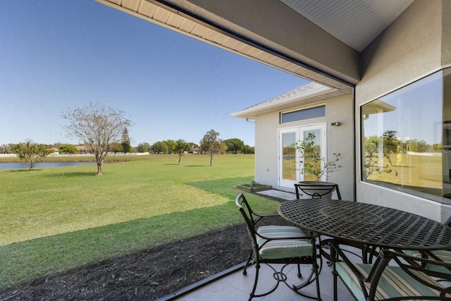 4606 Lake Fox Pl, Parrish, FL 34219 - sunroom / solarium with a water view, french doors, and outdoor dining space