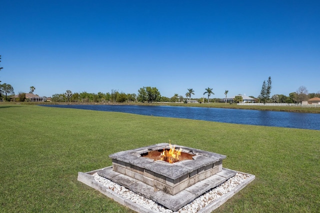 4606 Lake Fox Pl, Parrish, FL 34219 - view of grassy yard with a water view and a fire pit