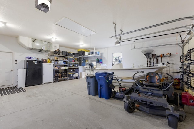 4606 Lake Fox Pl, Parrish, FL 34219 - garage featuring freestanding refrigerator and a garage door opener