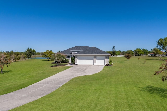 4606 Lake Fox Pl, Parrish, FL 34219 - view of grassy yard featuring concrete driveway, a garage, and a water view