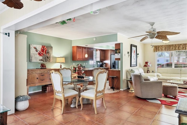 dining area with light tile patterned flooring and a ceiling fan