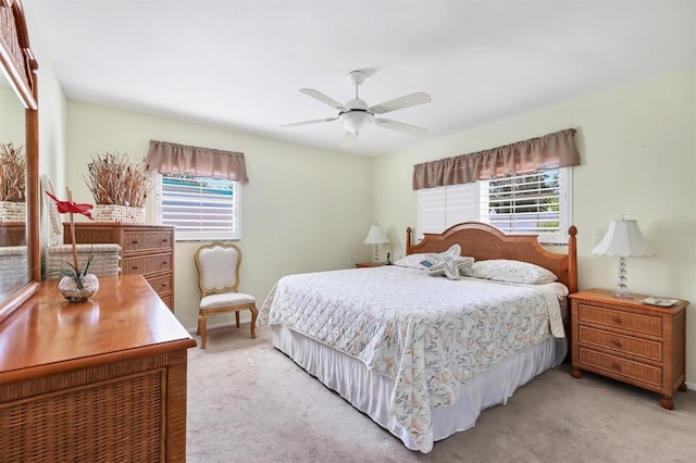 bedroom featuring light carpet and ceiling fan