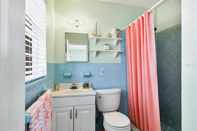 bathroom featuring wainscoting, toilet, tile walls, and a shower stall