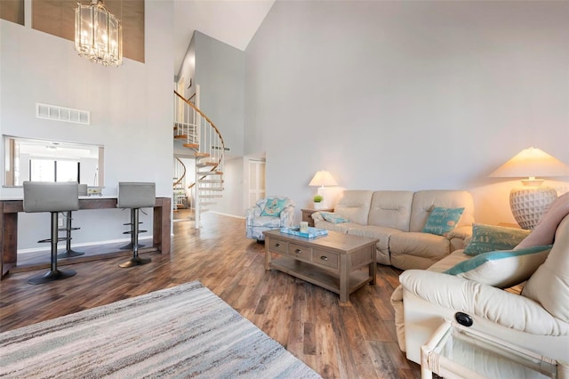 6263 Midnight Pass Rd Unit 301, Sarasota, FL 34242 - living room with stairs, high vaulted ceiling, wood finished floors, baseboards, and a chandelier