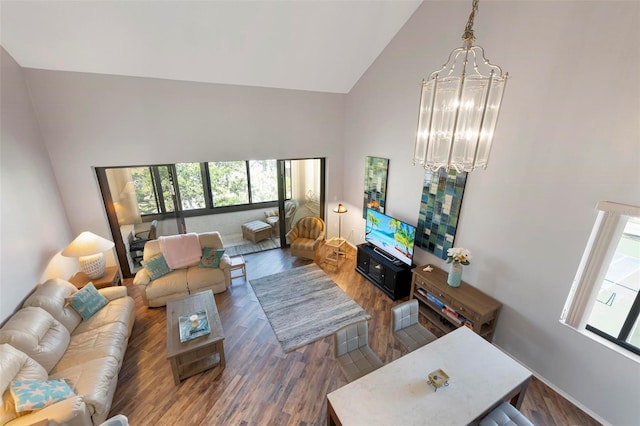 6263 Midnight Pass Rd Unit 301, Sarasota, FL 34242 - living area with high vaulted ceiling, plenty of natural light, a chandelier, wood finished floors, and baseboards