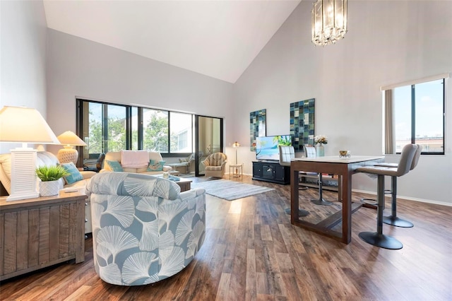 6263 Midnight Pass Rd Unit 301, Sarasota, FL 34242 - living area with high vaulted ceiling, wood finished floors, a chandelier, and baseboards