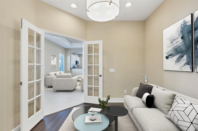 living room with recessed lighting, french doors, and dark wood finished floors