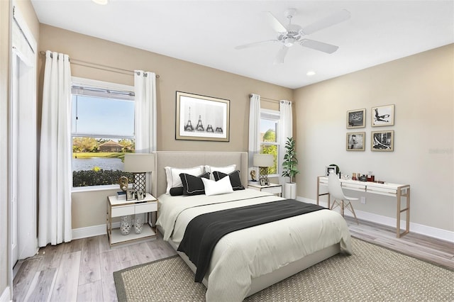bedroom featuring recessed lighting, light wood finished floors, ceiling fan, and baseboards