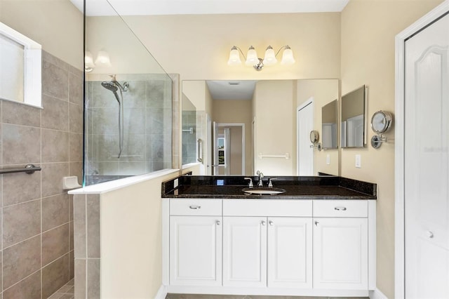 full bathroom featuring vanity and walk in shower
