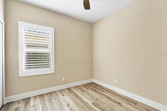 unfurnished room featuring light wood-style floors, baseboards, and ceiling fan