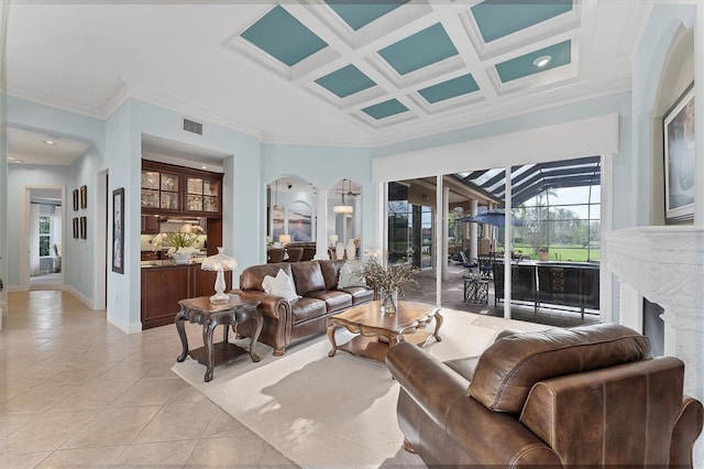 living room featuring visible vents, baseboards, light tile patterned floors, ornamental molding, and coffered ceiling