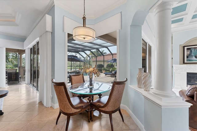dining space with crown molding, plenty of natural light, and light tile patterned flooring