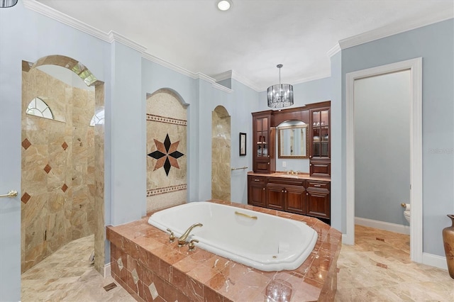 full bath with a tile shower, a bath, vanity, ornamental molding, and a notable chandelier
