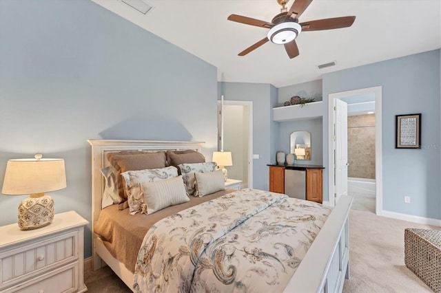bedroom with visible vents, baseboards, refrigerator, and light carpet