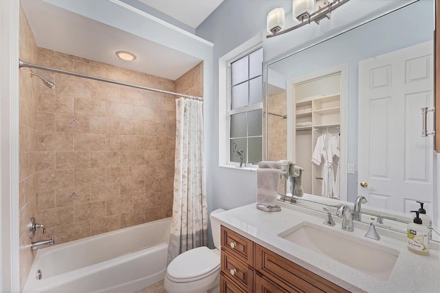 bathroom featuring shower / bathtub combination with curtain, vanity, and toilet