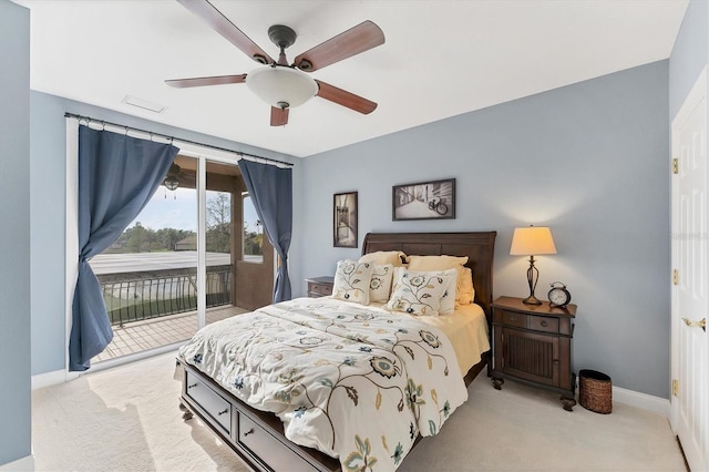 carpeted bedroom with access to outside, ceiling fan, and baseboards
