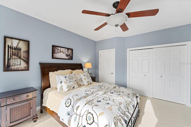 carpeted bedroom with a closet and a ceiling fan