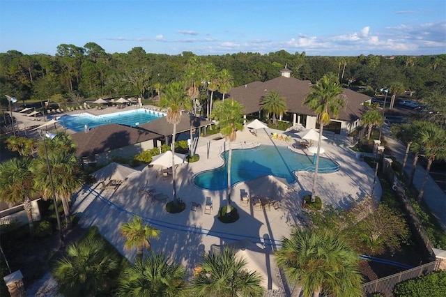 birds eye view of property with a wooded view