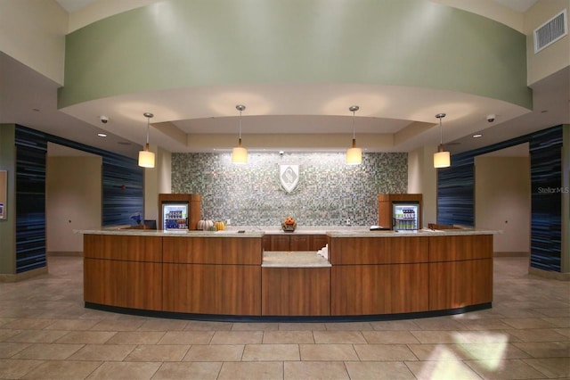 reception featuring a fireplace and visible vents