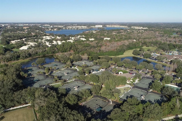 drone / aerial view with a water view and a residential view