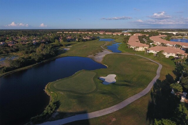 bird's eye view featuring golf course view and a water view