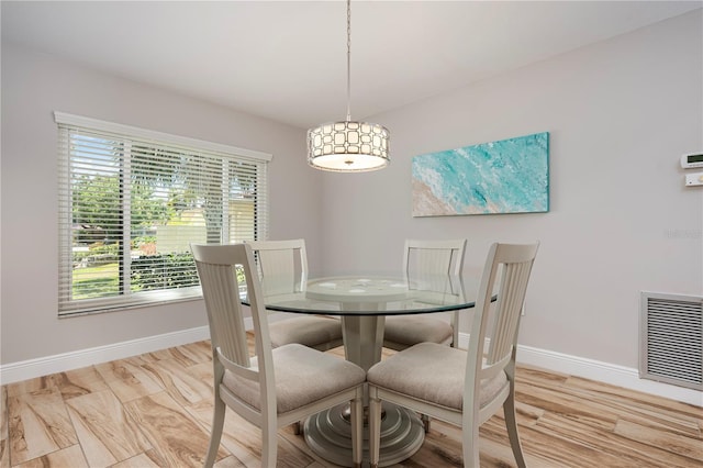 3804 Sun Eagle Ln, Bradenton, FL 34210 - dining space featuring baseboards, light wood-style flooring, and visible vents