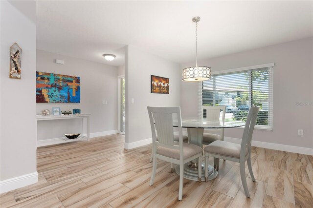 3804 Sun Eagle Ln, Bradenton, FL 34210 - dining area featuring baseboards and light wood-style floors