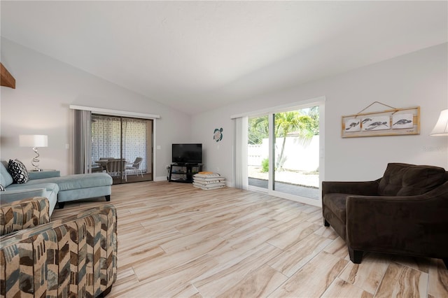 3804 Sun Eagle Ln, Bradenton, FL 34210 - living room featuring lofted ceiling and light wood-style floors