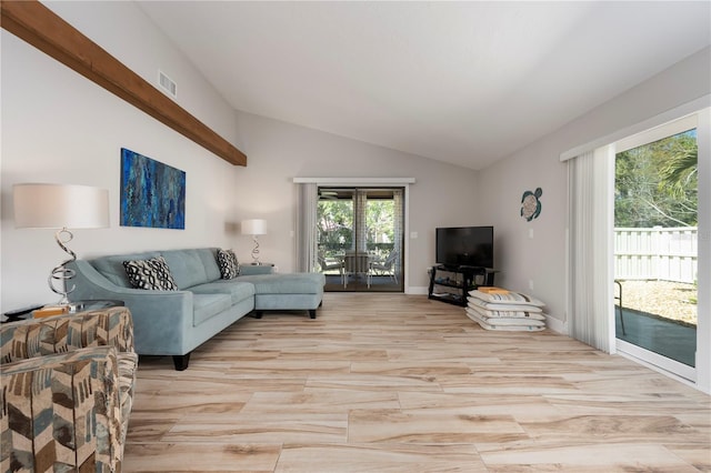 3804 Sun Eagle Ln, Bradenton, FL 34210 - living area with visible vents, vaulted ceiling, and light wood finished floors