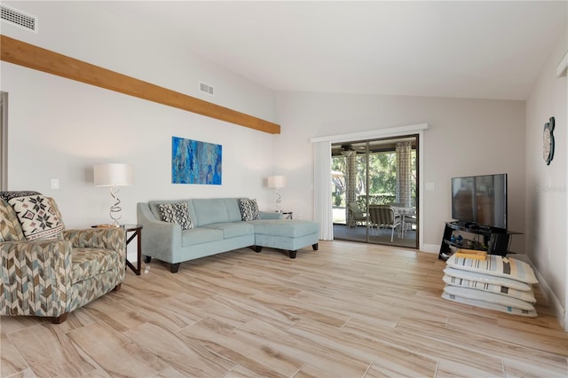3804 Sun Eagle Ln, Bradenton, FL 34210 - living area with wood finished floors, baseboards, vaulted ceiling, and visible vents