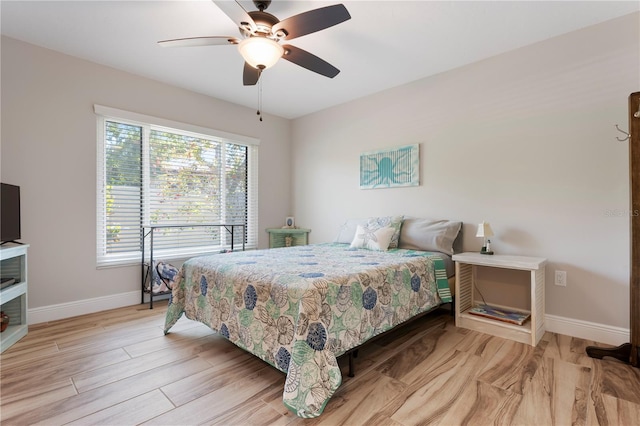 3804 Sun Eagle Ln, Bradenton, FL 34210 - bedroom with baseboards, ceiling fan, and light wood-style floors