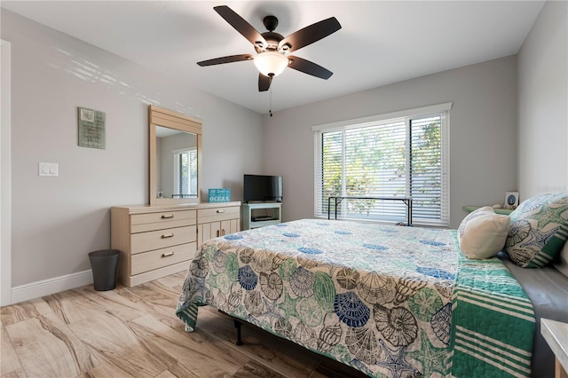 3804 Sun Eagle Ln, Bradenton, FL 34210 - bedroom with baseboards, ceiling fan, and multiple windows