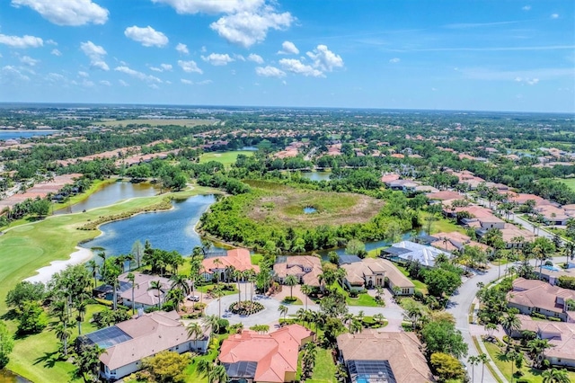 bird's eye view with a water view, a residential view, and golf course view