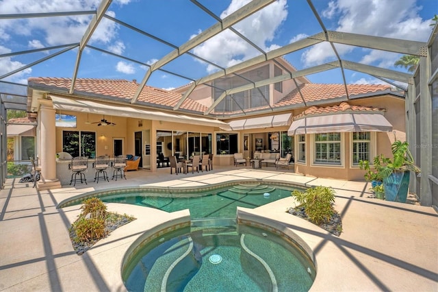 view of pool with a patio, outdoor dry bar, an outdoor hangout area, and a pool with connected hot tub