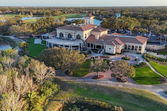 bird's eye view with a water view and golf course view